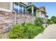 Exterior view of home with stone accents and landscaped yard at 529 Gallegos Cir, Erie, CO 80516