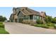 Exterior view of multi-unit building with green siding and stone accents at 529 Gallegos Cir, Erie, CO 80516