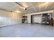 Spacious garage with shelving for storage and epoxy flooring at 529 Gallegos Cir, Erie, CO 80516