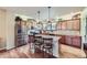 Modern kitchen with granite countertops, stainless steel appliances, and hardwood floors at 529 Gallegos Cir, Erie, CO 80516