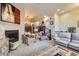 Bright living area with fireplace and comfortable seating with stairs to other floors at 529 Gallegos Cir, Erie, CO 80516