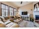 Neutral living area with lots of natural light and a large sectional sofa at 529 Gallegos Cir, Erie, CO 80516