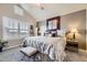 Serene main bedroom with a vaulted ceiling, large windows, and stylish decor at 529 Gallegos Cir, Erie, CO 80516