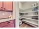 Spacious walk-in pantry with organized shelving and ample storage space for household goods at 529 Gallegos Cir, Erie, CO 80516