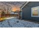 Cozy backyard with pergola and snowy ground at 257 Wadsworth Cir, Longmont, CO 80504