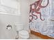 Clean bathroom with nautical shower curtain and toilet at 257 Wadsworth Cir, Longmont, CO 80504