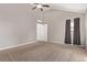 Primary bedroom with window, closet, and carpet flooring at 257 Wadsworth Cir, Longmont, CO 80504