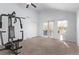 Spacious bedroom with balcony access and home gym at 257 Wadsworth Cir, Longmont, CO 80504