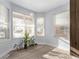 Bright dining area with bay windows and wood-look floors at 257 Wadsworth Cir, Longmont, CO 80504