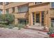 Inviting brick entrance with stylish lighting and well-maintained landscaping at 1523 Ivy St # 6, Denver, CO 80220