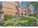 Apartment building with manicured lawn and beautiful landscaping features at 1523 Ivy St # 6, Denver, CO 80220