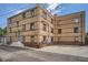 Brick apartment building featuring multiple units and convenient parking area at 1523 Ivy St # 6, Denver, CO 80220