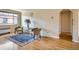 Charming living room featuring hardwood floors, neutral walls, large window, and comfortable seating at 1523 Ivy St # 6, Denver, CO 80220