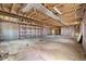 Spacious unfinished basement showing exposed beams, concrete flooring, and future potential at 449 Dunmire St, Frederick, CO 80530