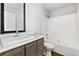 Cozy bathroom features a single sink vanity with a shower and tub combination at 449 Dunmire St, Frederick, CO 80530