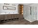 This spacious bathroom features double sinks, storage cabinets, and a glass-enclosed shower at 449 Dunmire St, Frederick, CO 80530