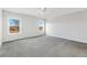 This bedroom features neutral paint, carpet floors and two windows with views at 449 Dunmire St, Frederick, CO 80530