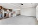 The open floor plan living room boasts large windows and provides seamless access to the kitchen and dining area at 449 Dunmire St, Frederick, CO 80530