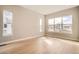 Empty bedroom with hardwood flooring and large windows with natural light at 483 Basin Daisy St, Castle Rock, CO 80104