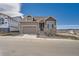 Beautiful two-story home with stylish stone accents, an attached garage, and a welcoming entrance at 483 Basin Daisy St, Castle Rock, CO 80104