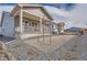 Home exterior showcasing a covered porch and gravel landscape, providing a comfortable space at 483 Basin Daisy St, Castle Rock, CO 80104