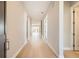 Spacious hallway with hardwood floors and a view to the living area at 483 Basin Daisy St, Castle Rock, CO 80104