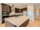 Spacious kitchen island with marble countertop and stainless faucet. Hardwood floors throughout at 483 Basin Daisy St, Castle Rock, CO 80104