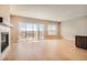 Bright, open living room with a fireplace and large sliding glass doors to a deck at 483 Basin Daisy St, Castle Rock, CO 80104