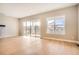 Open living area featuring large windows, hardwood floors, and modern finishes at 483 Basin Daisy St, Castle Rock, CO 80104