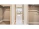 Empty walk-in closet with hardwood flooring and window with natural light at 483 Basin Daisy St, Castle Rock, CO 80104
