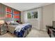 Bright bedroom with a large window and flag at 25694 Stansbery St, Conifer, CO 80433