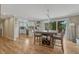 Open kitchen and dining area with hardwood floors and access to the outdoor deck at 25694 Stansbery St, Conifer, CO 80433