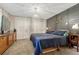 Comfortable main bedroom offers plush carpeting, stylish light fixture, and plenty of closet space at 25694 Stansbery St, Conifer, CO 80433