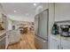 Bright kitchen featuring stainless appliances, granite counters, and an open floor plan to the dining area at 25694 Stansbery St, Conifer, CO 80433