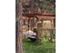 Shaded hammock with room for two set among the trees, flowers, and vines on a peaceful lot at 5030 Cedar Way, Elizabeth, CO 80107
