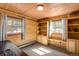 Bright office space with paneled walls, built-in shelving and natural light at 5030 Cedar Way, Elizabeth, CO 80107