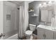 Cozy bathroom featuring a combined shower and tub, modern fixtures, and stylish gray accents at 5285 S Jericho Way, Centennial, CO 80015