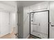 Contemporary bathroom showcasing a glass-enclosed shower with subway tile and dark hardware at 5285 S Jericho Way, Centennial, CO 80015