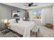 Serene bedroom featuring a plush white bed, ample natural light, and stylish contemporary decor at 5285 S Jericho Way, Centennial, CO 80015