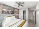 Charming bedroom showcasing wood-paneled wall accents, neutral decor, and comfortable furnishings at 5285 S Jericho Way, Centennial, CO 80015