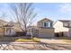 Charming two-story home with a well-maintained lawn and inviting curb appeal on a sunny day at 5285 S Jericho Way, Centennial, CO 80015