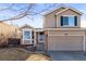 Charming home exterior with manicured front yard and two-car garage at 5285 S Jericho Way, Centennial, CO 80015