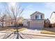 Inviting front exterior of a home with a two-car garage at 5285 S Jericho Way, Centennial, CO 80015