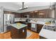 Spacious kitchen features stainless steel appliances, abundant counter space, and well-crafted wood floors at 5285 S Jericho Way, Centennial, CO 80015