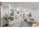 Bright living room with recessed lights, custom built-ins, neutral walls, and comfortable seating area at 5285 S Jericho Way, Centennial, CO 80015