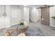 Well-lit living room featuring modern decor, a trendy barn door, and a cozy seating arrangement at 5285 S Jericho Way, Centennial, CO 80015