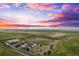 Aerial view of house, outbuildings, and large lot at 7905 Schumaker Rd, Bennett, CO 80102