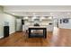 Basement kitchenette with modern appliances and island at 7905 Schumaker Rd, Bennett, CO 80102