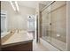 Bathroom with shower/tub combo and updated vanity at 7905 Schumaker Rd, Bennett, CO 80102