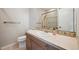 Clean bathroom with single sink vanity, toilet and shower at 7905 Schumaker Rd, Bennett, CO 80102